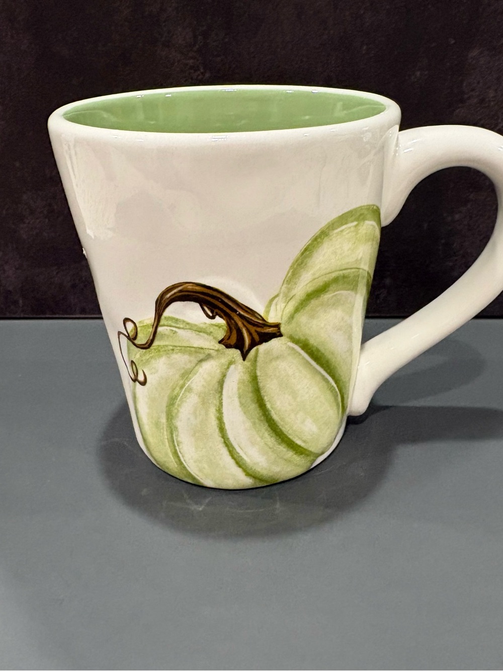 Cream Ceramic Mug with Light Green Pumpkin Accent and Green Interior